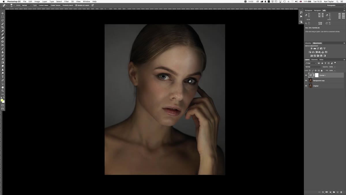 Portrait with forehead and wrist highlighted, uneven lighting visible