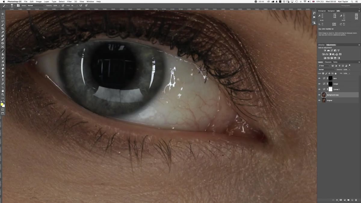 Zoomed eye with visible veins and catchlight reflections