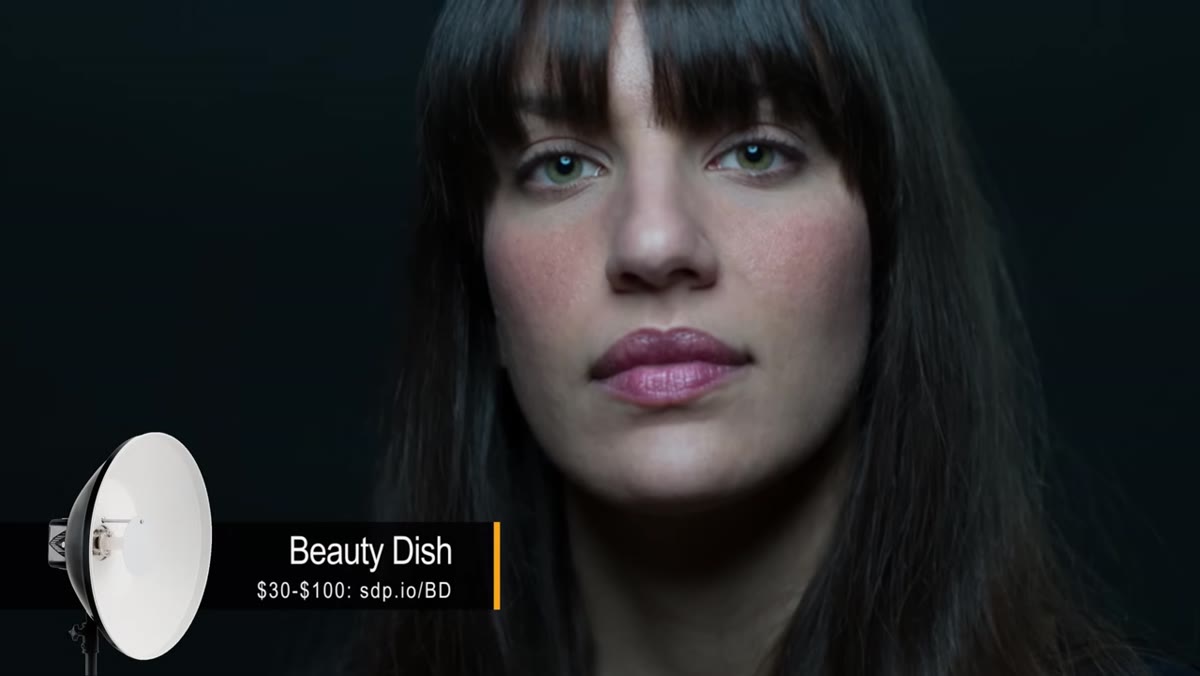 Tony positioning beauty dish close to Chelsea&rsquo;s face on axis