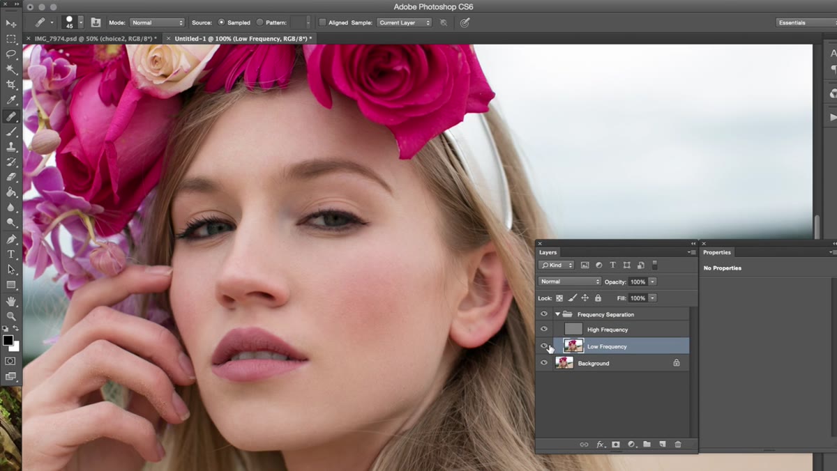 Painting over skin tones on the low-frequency layer with soft brush