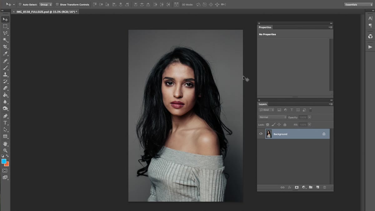 Crop tool active on a softbox-lit portrait