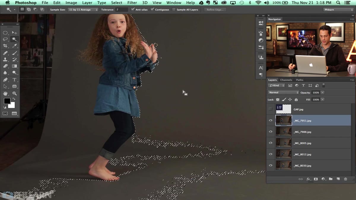 Magic Wand tool active, clicking gray backdrop outside subject
