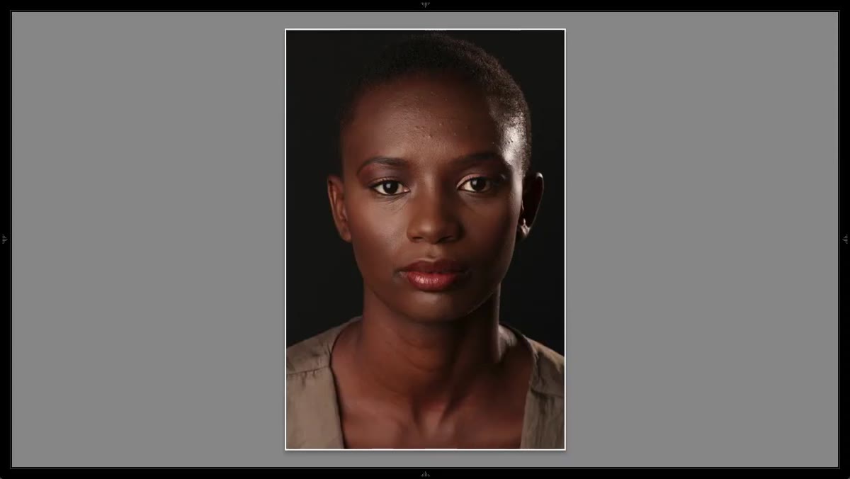 Photographer checking highlight on subject&rsquo;s head; highlight reading too hot
