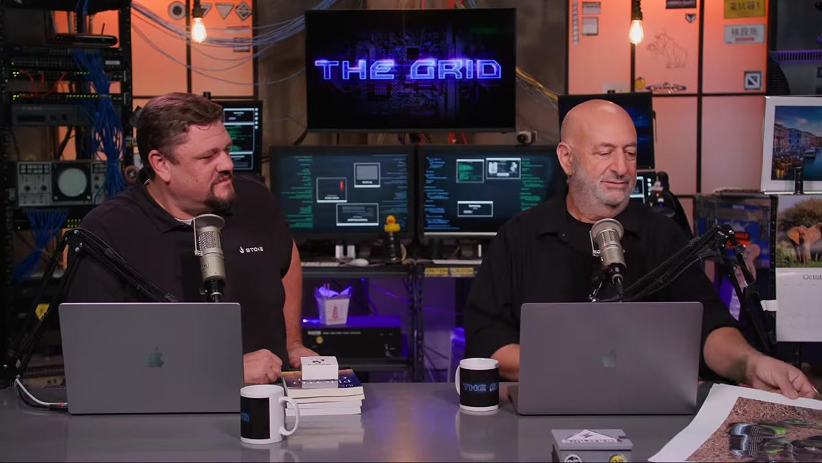 Hosts gesturing toward a cropped version of a submitted image