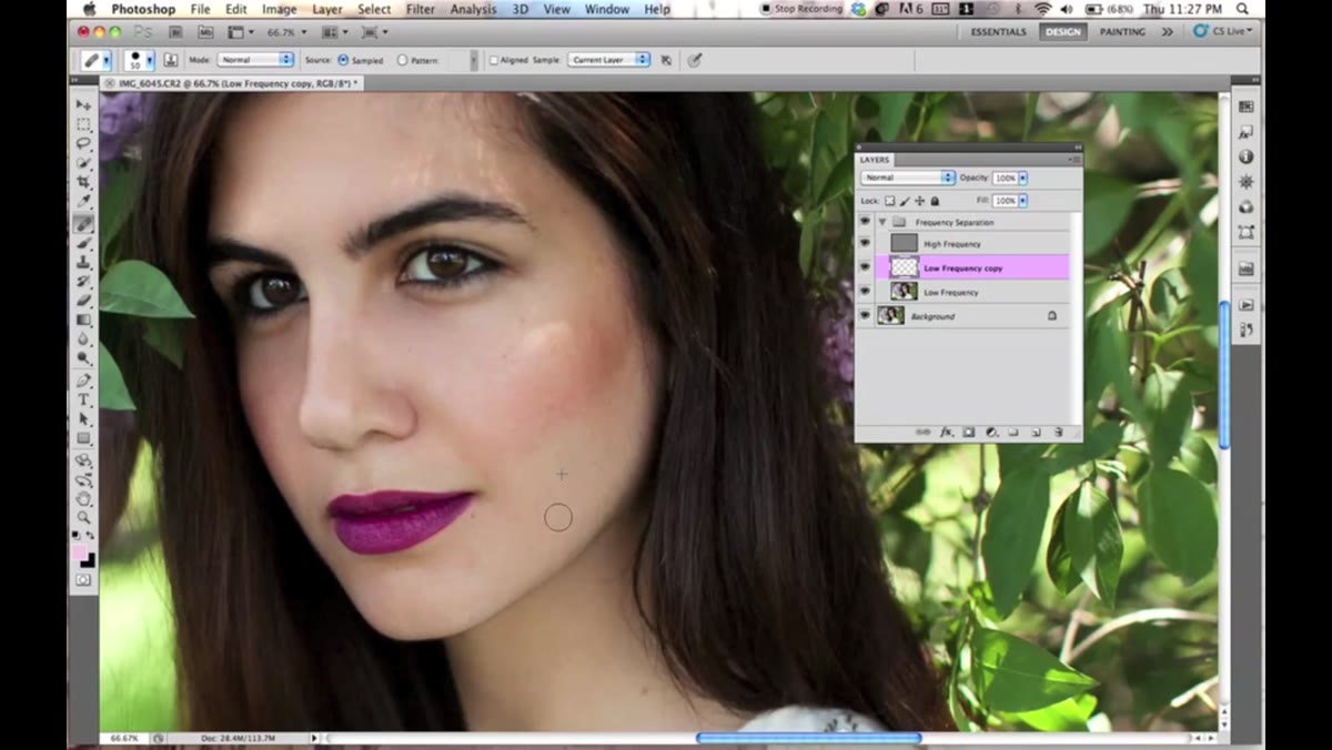 Wide shot of retouching in progress, tablet referenced in narration