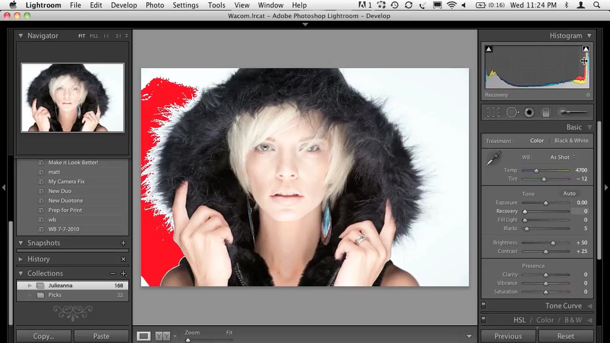 Red clipping overlay showing blown highlights on a high-key portrait