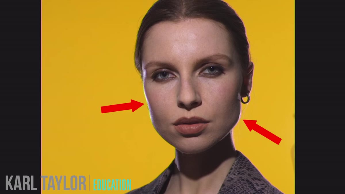 Rim light catching model&rsquo;s cheekbone and shoulder edge