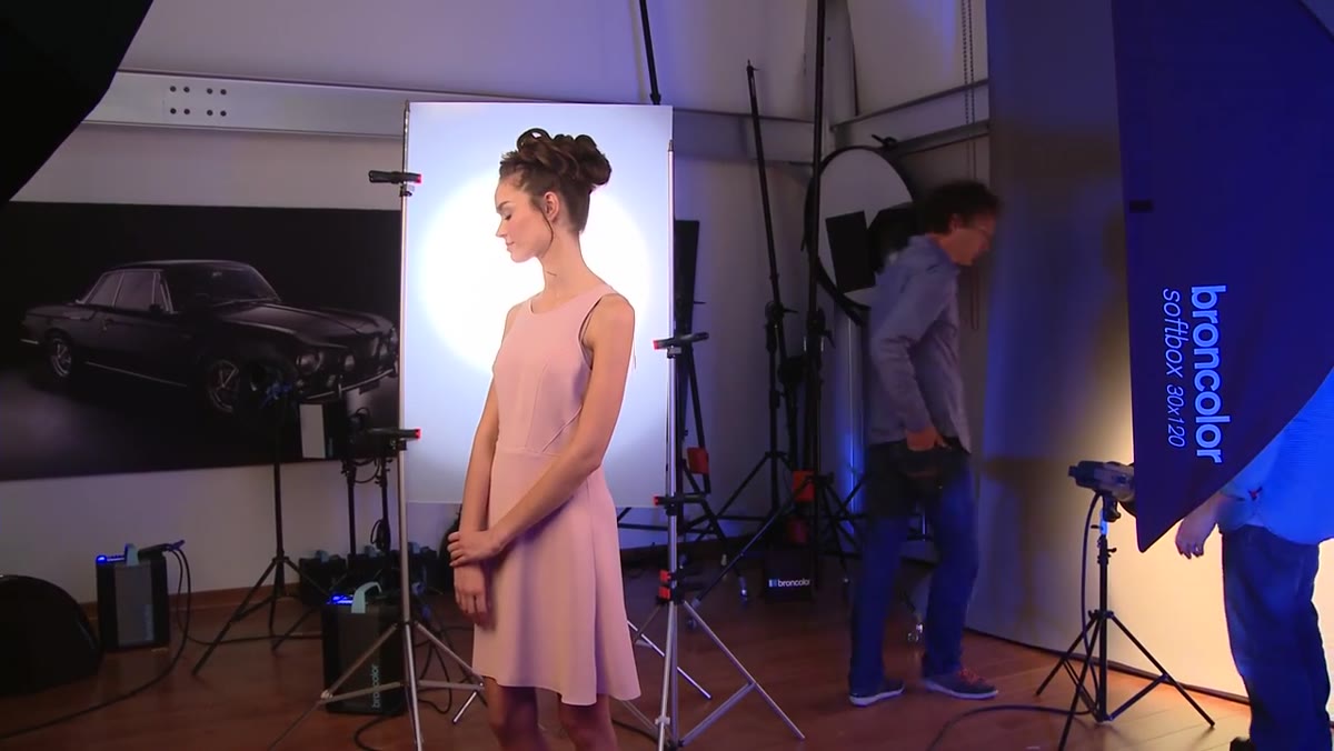 Background light positioned to feather and create gradient blend on backdrop