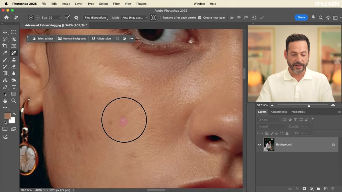 Brush painting over skin blemishes in the zoomed-in view